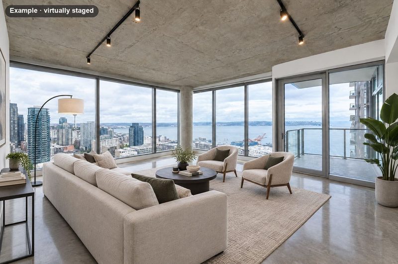 The same condo virtually staged with a sofa, two lounge chairs and a round coffee table